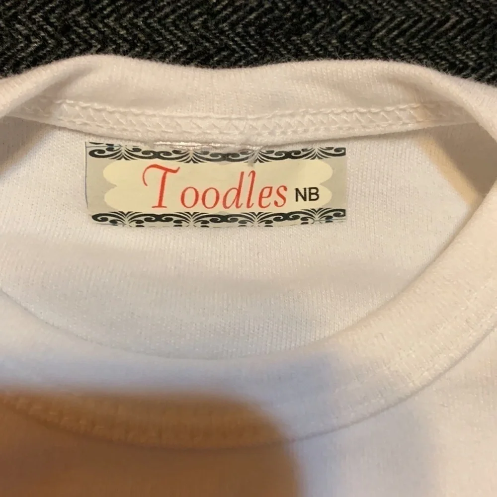 Toodles newborn gown with pink and white chevron print and flower